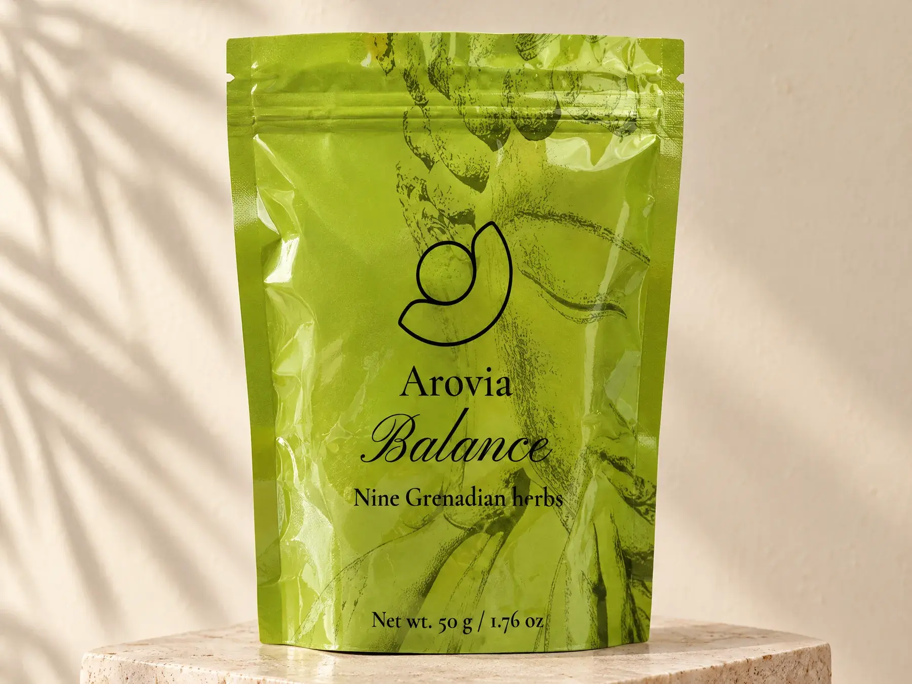 Arovia Balance tea pouch on a travertine plinth in soft morning light